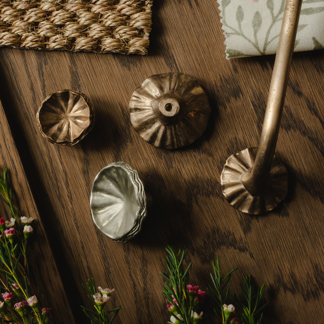 Photography by Joey Kendal Brown | Whimsical Tutu Cabinet Knobs and Whimsical Tutu Cabinet Handles shown in burnished bronze (BR) and burnished white bronze (WB). 