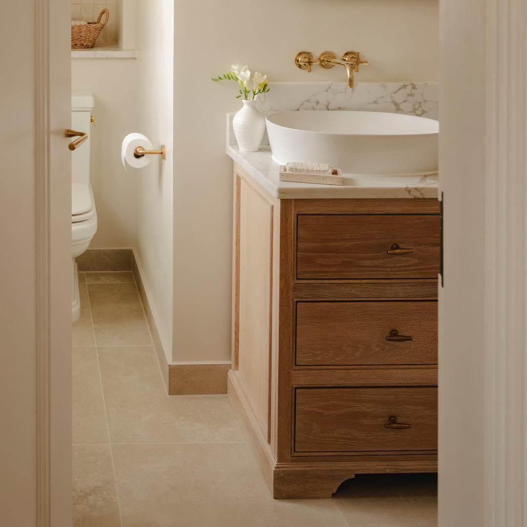 Photography by Joey Kendal Brown | Barwick Plain Toilet Roll Holder, Loop Lever Handle with Concealed Rose and Colmore T-bar Handles shown in our aged brass (BEL) finish.