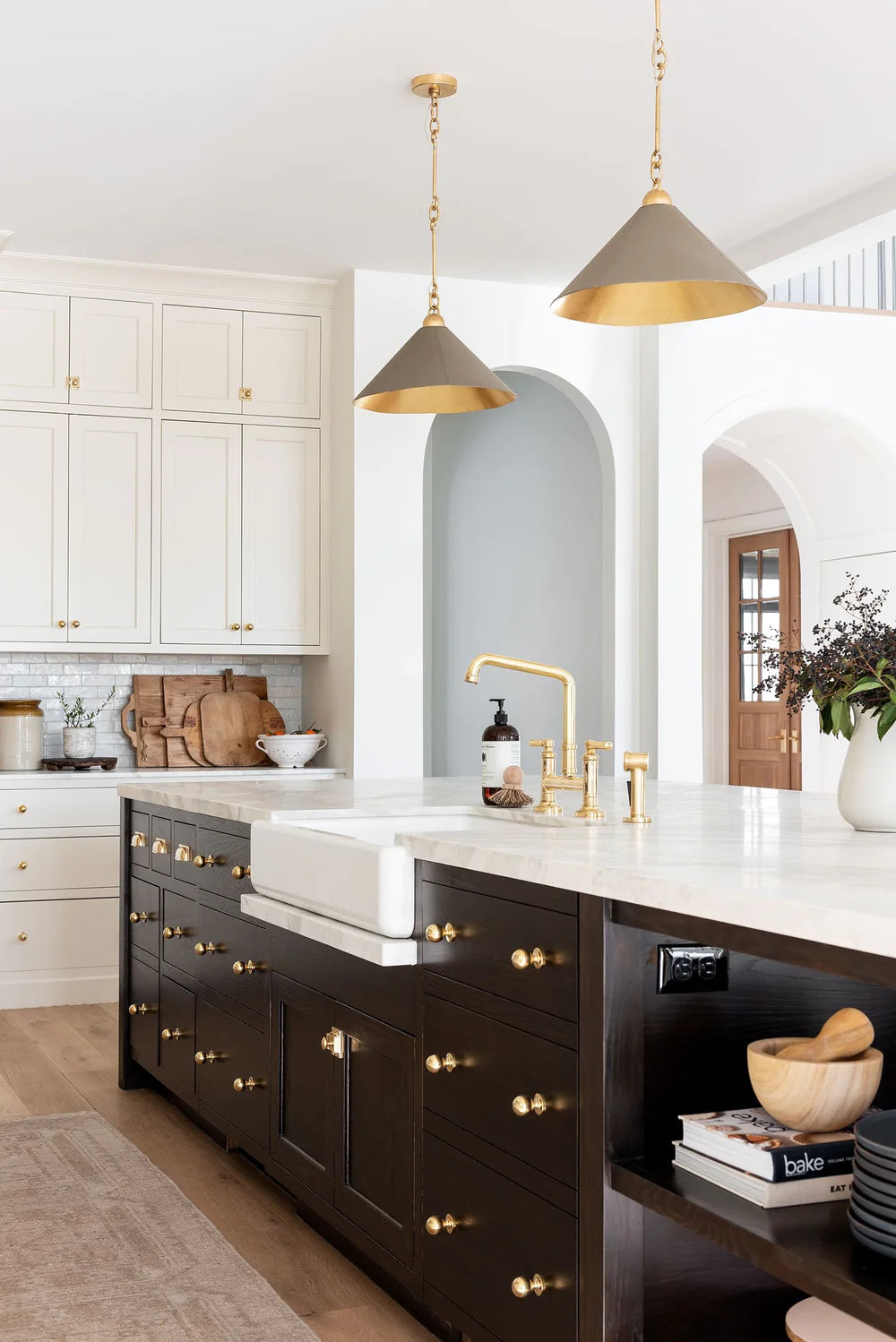 Brass architectural hardware coordinated throughout a finished interior